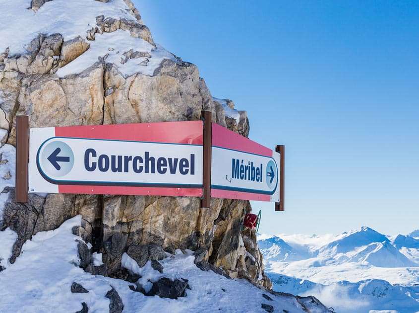 Directional sign pointing towards Courchevel and Méribel in the heart of the Three Valleys.