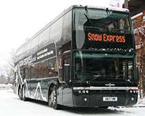 Snow Express Double-Decker Bus in a Winter Landscape
